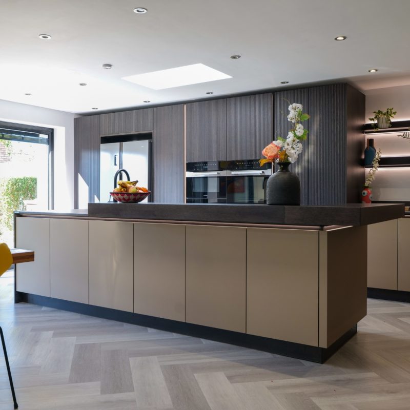 neoLodge Blackened Oak and GTD Graphite kitchen with dining table and herringbone flooring, Derby