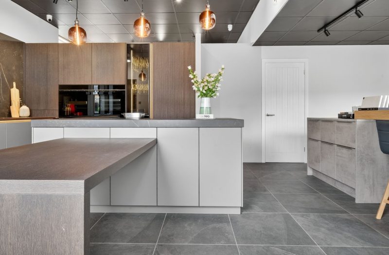 Nolte neoLodge kitchen display at the Bath showroom featuring textured cabinetry, handleless units, integrated appliances and a contemporary island.