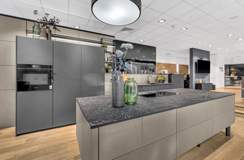 Modern Black & gold handleless kitchen in Nolte Kitchen Westminster