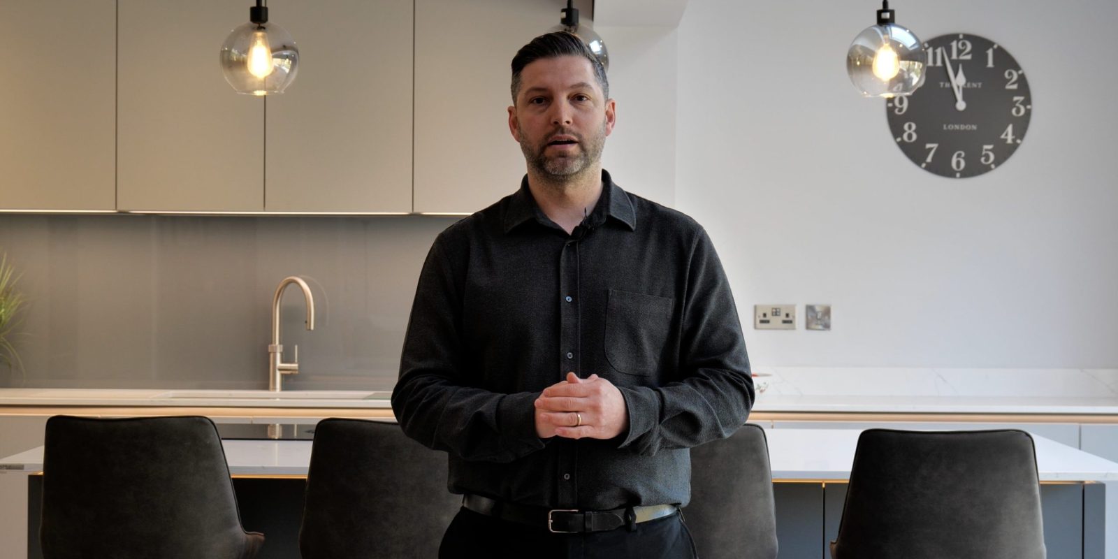 kitchen designer Navid from our kitchen showroom in wilsmlows talking through a customers kitchen